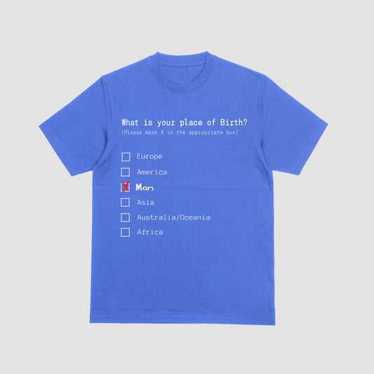 Blue t-shirt with a humorous 'place of birth' questionnaire on a light gray background